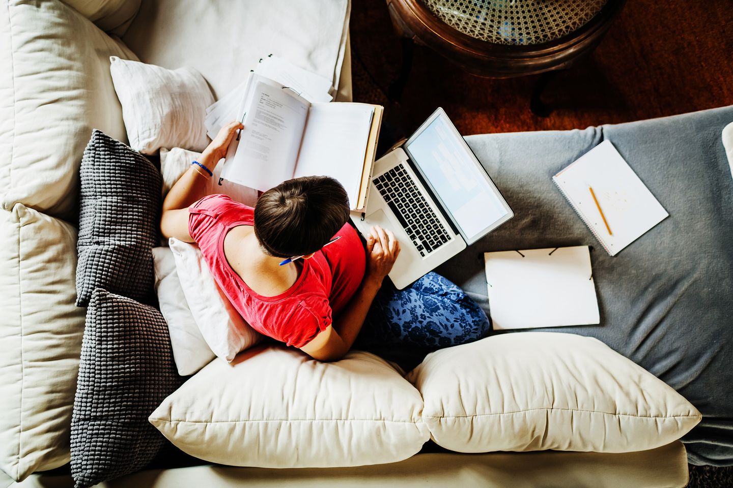 Aerial View Of Pregnant Mother Working From Home